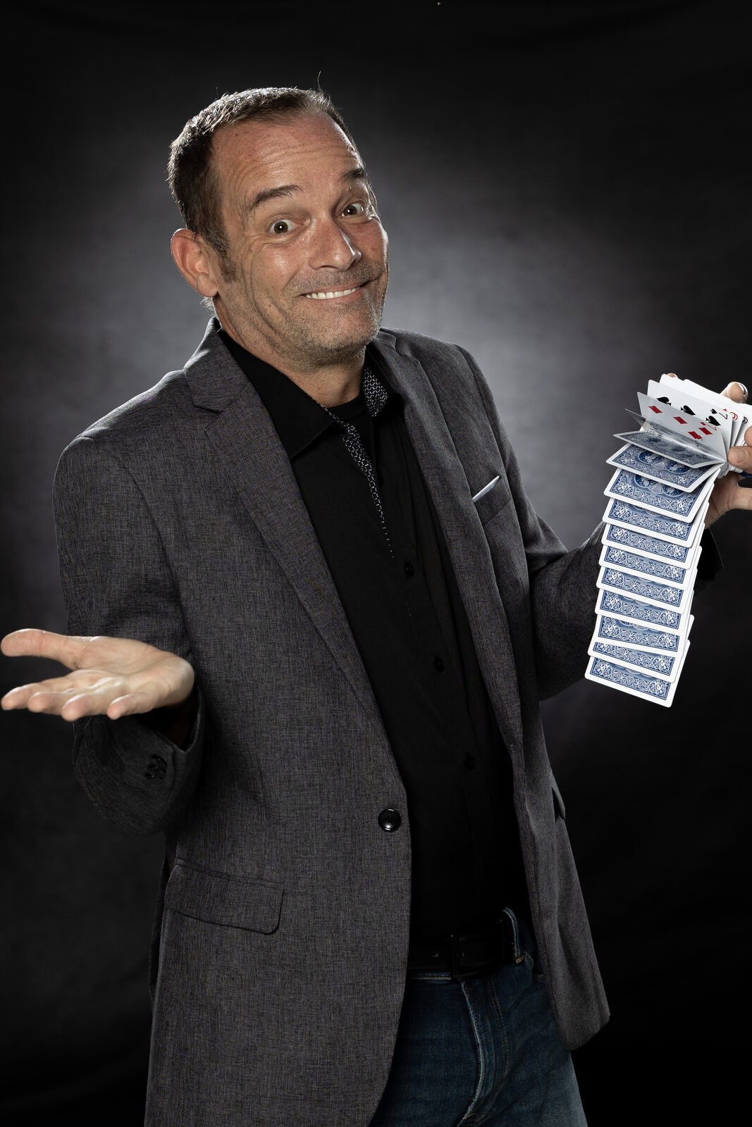 Close-up of a playing card cascade — Chad Currin performing close-up mentalism
